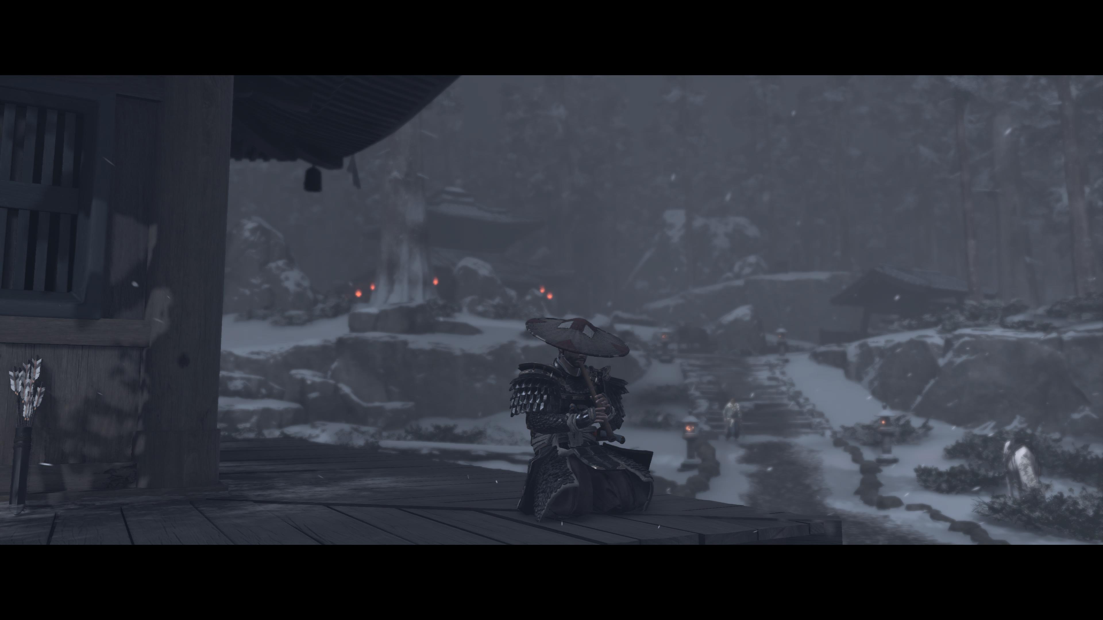 A samurai sitting and playing a flute by a cottage